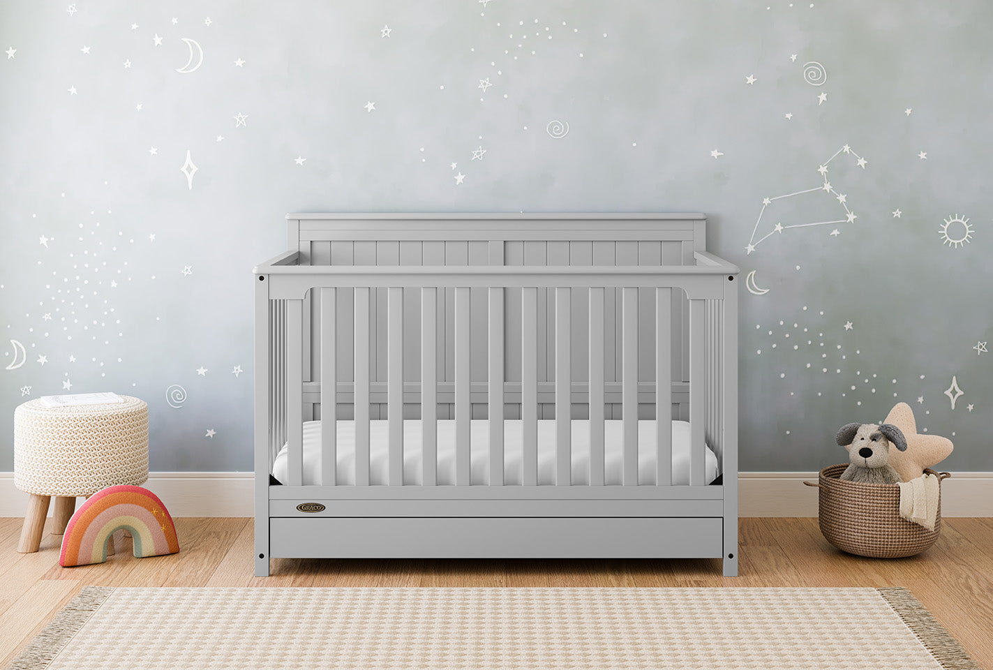 pebble gray crib with drawer in nursery