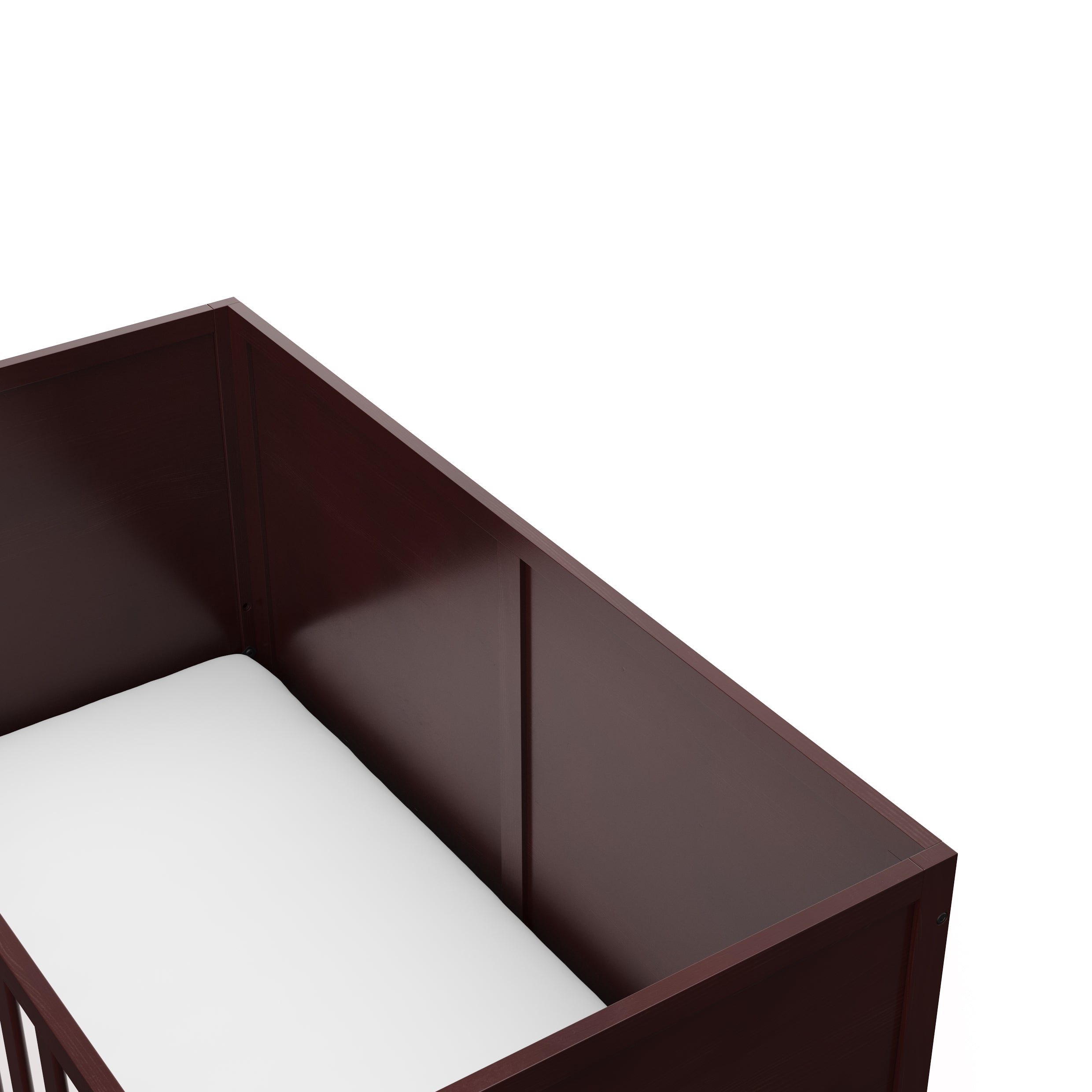 Close-up view of espresso crib's headboard