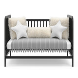 Black crib in toddler bed conversion