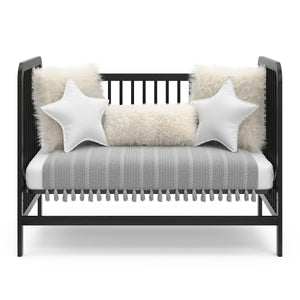 Black crib in toddler bed conversion 