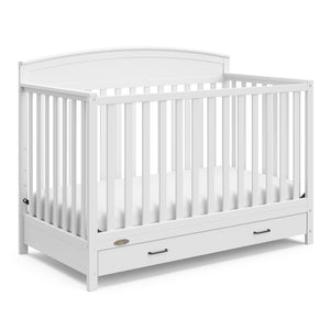 White crib with drawer angled