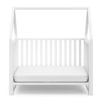 White crib in toddler bed conversion