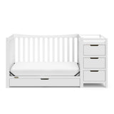 White crib and changer with drawer in toddler bed conversion