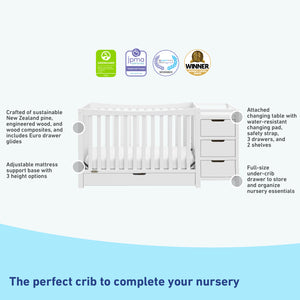 White crib and changer features graphic
