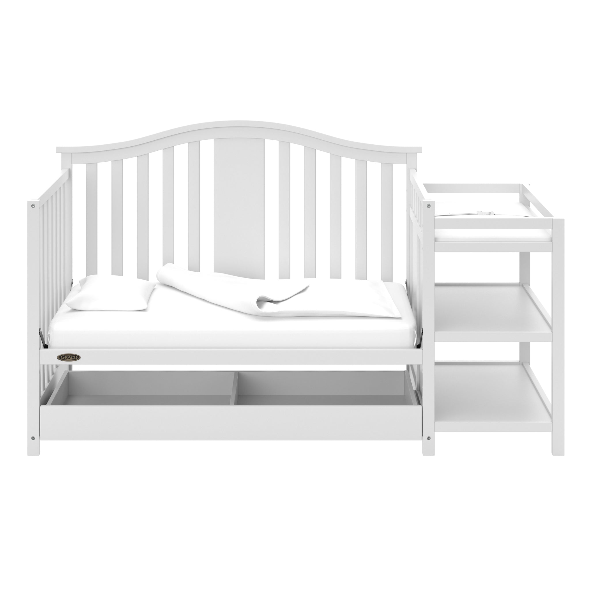 White crib and changer in daybed conversion with open drawer