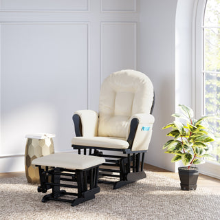 black glider and ottoman with beige cushions in nursery