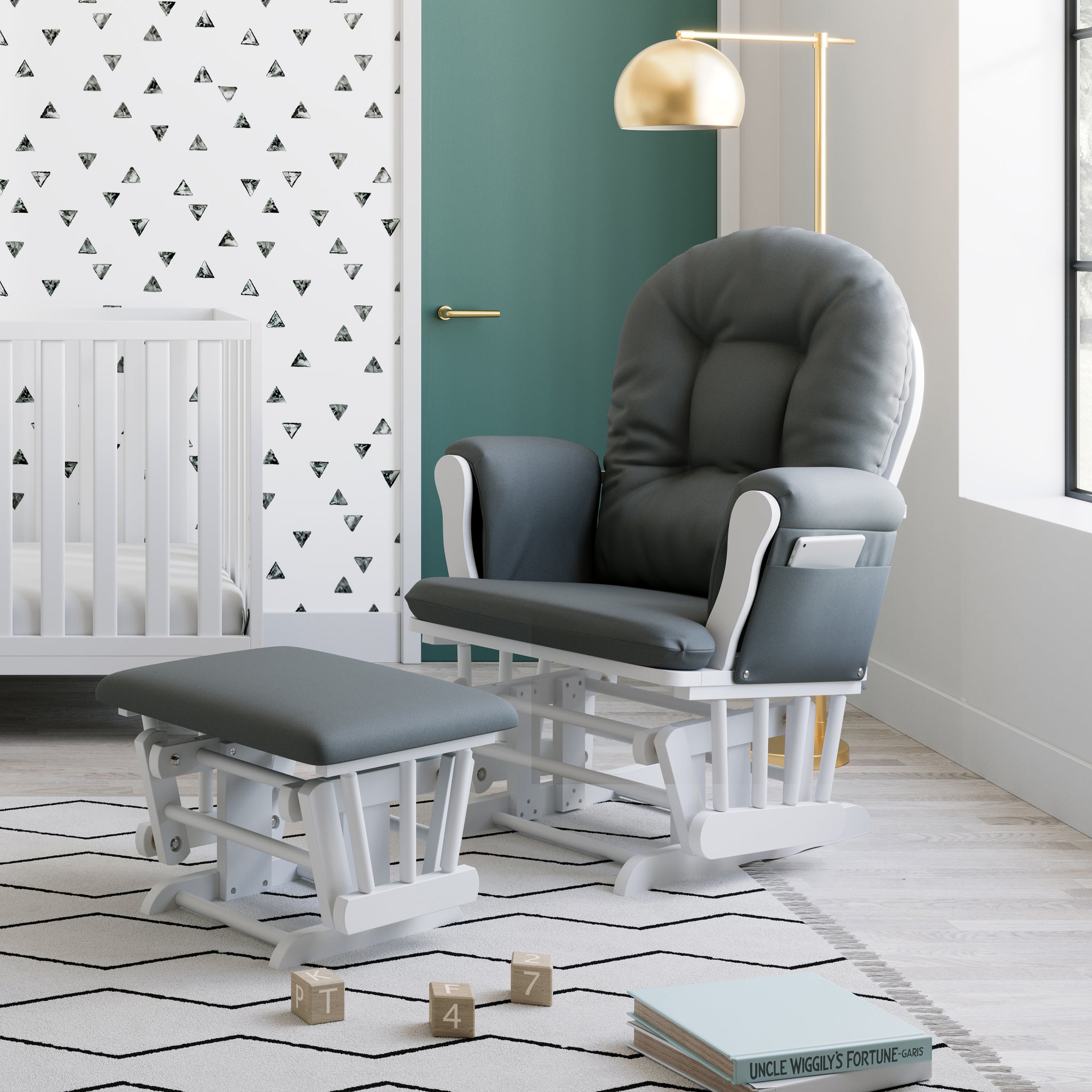 white glider and ottoman with gray cushions in nursery
