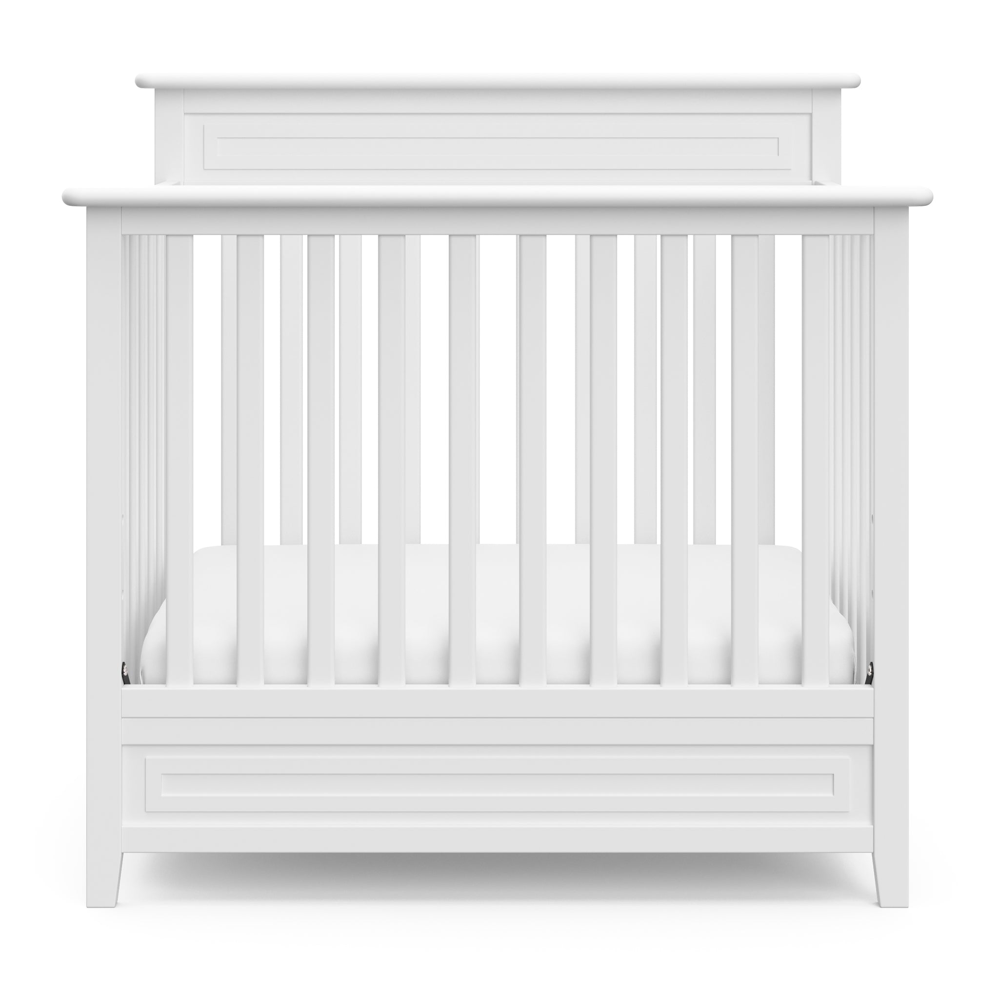 Front view of white mini crib 