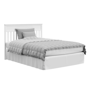 White crib in full-size bed with headboard conversion
