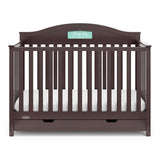 Front view of espresso crib with drawer