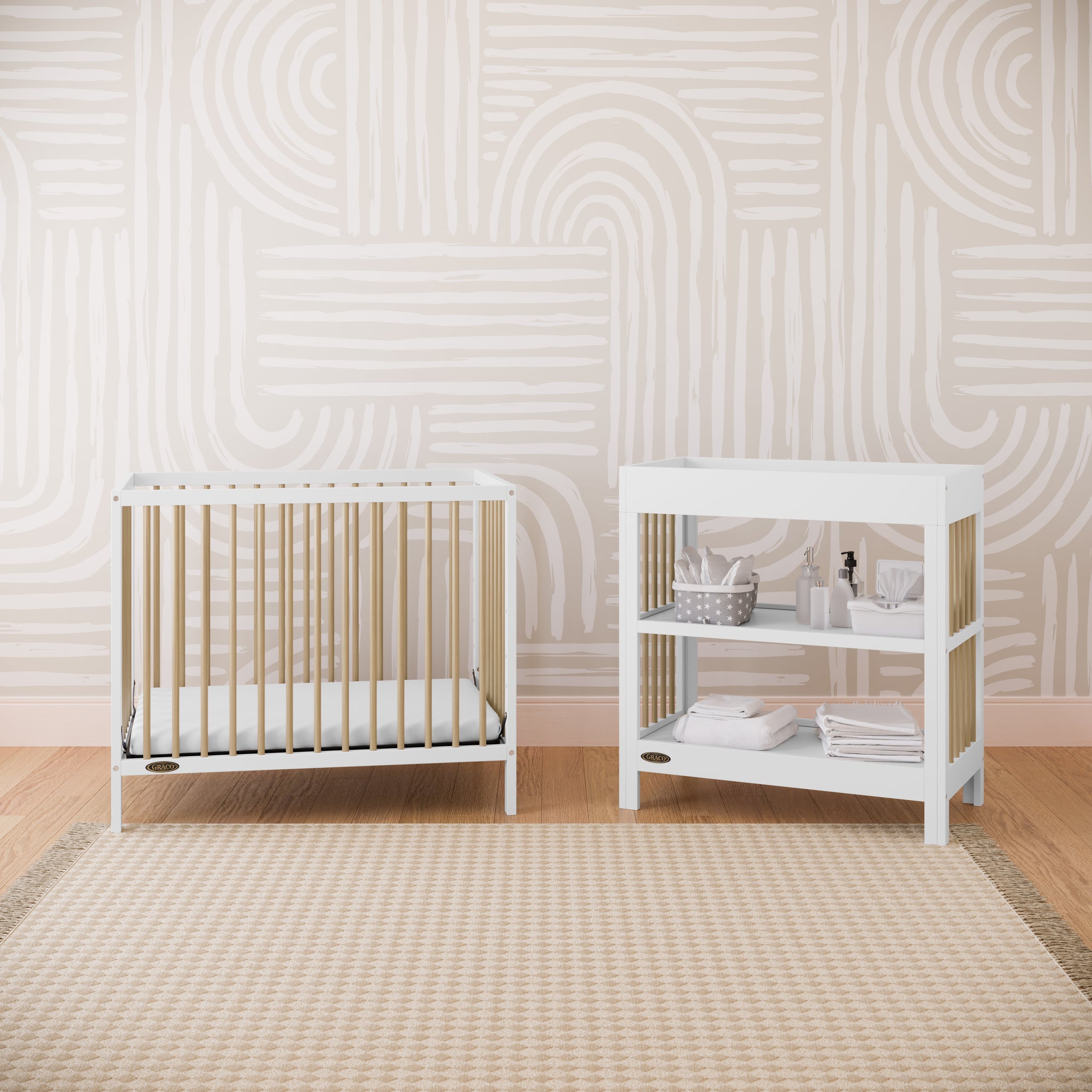 white with driftwood changing table and mini crib in nursery