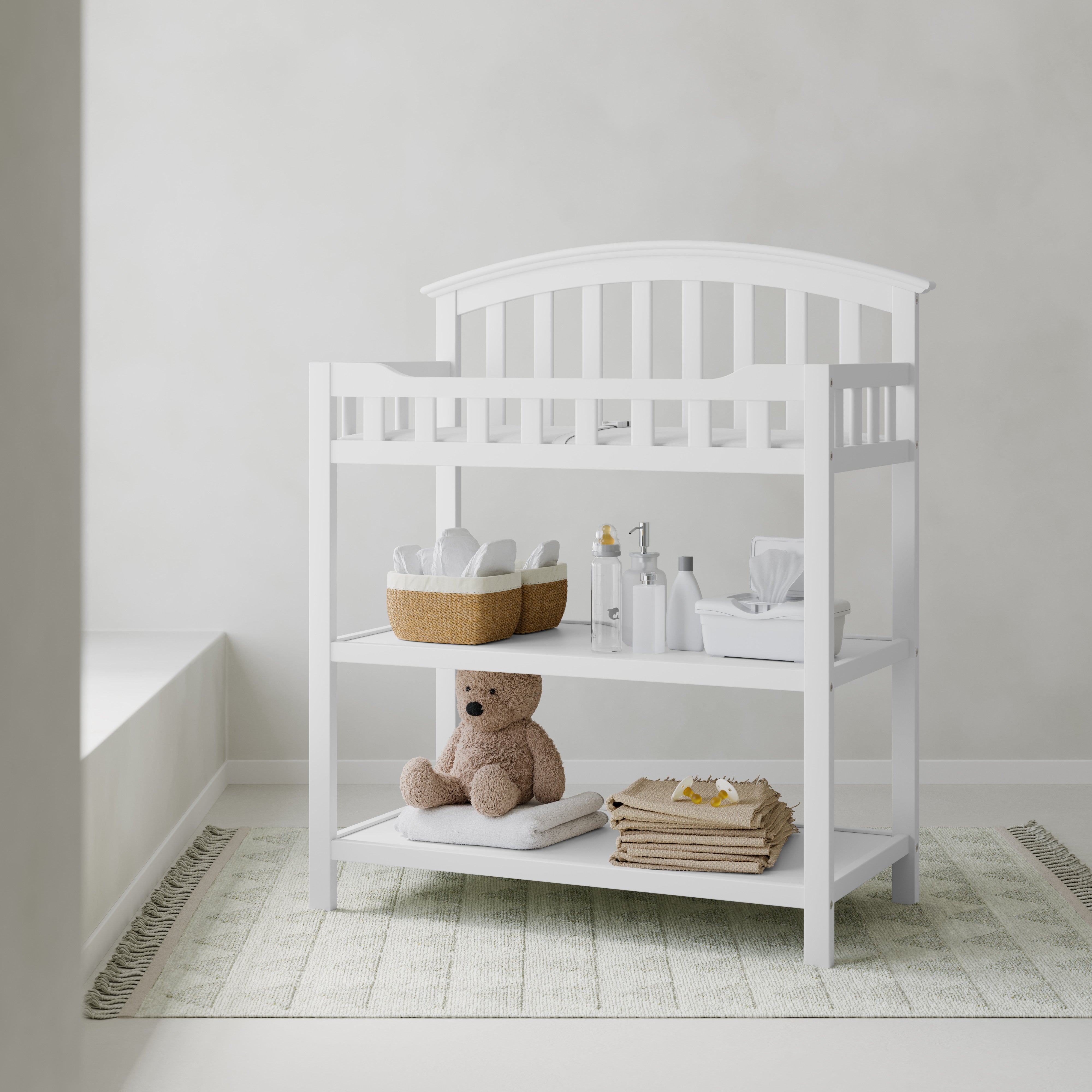 Graco white changing table in nursery
