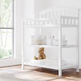 Graco white changing table in nursery