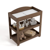 Customizable hazelnut changing table with baby items on both shelves top view