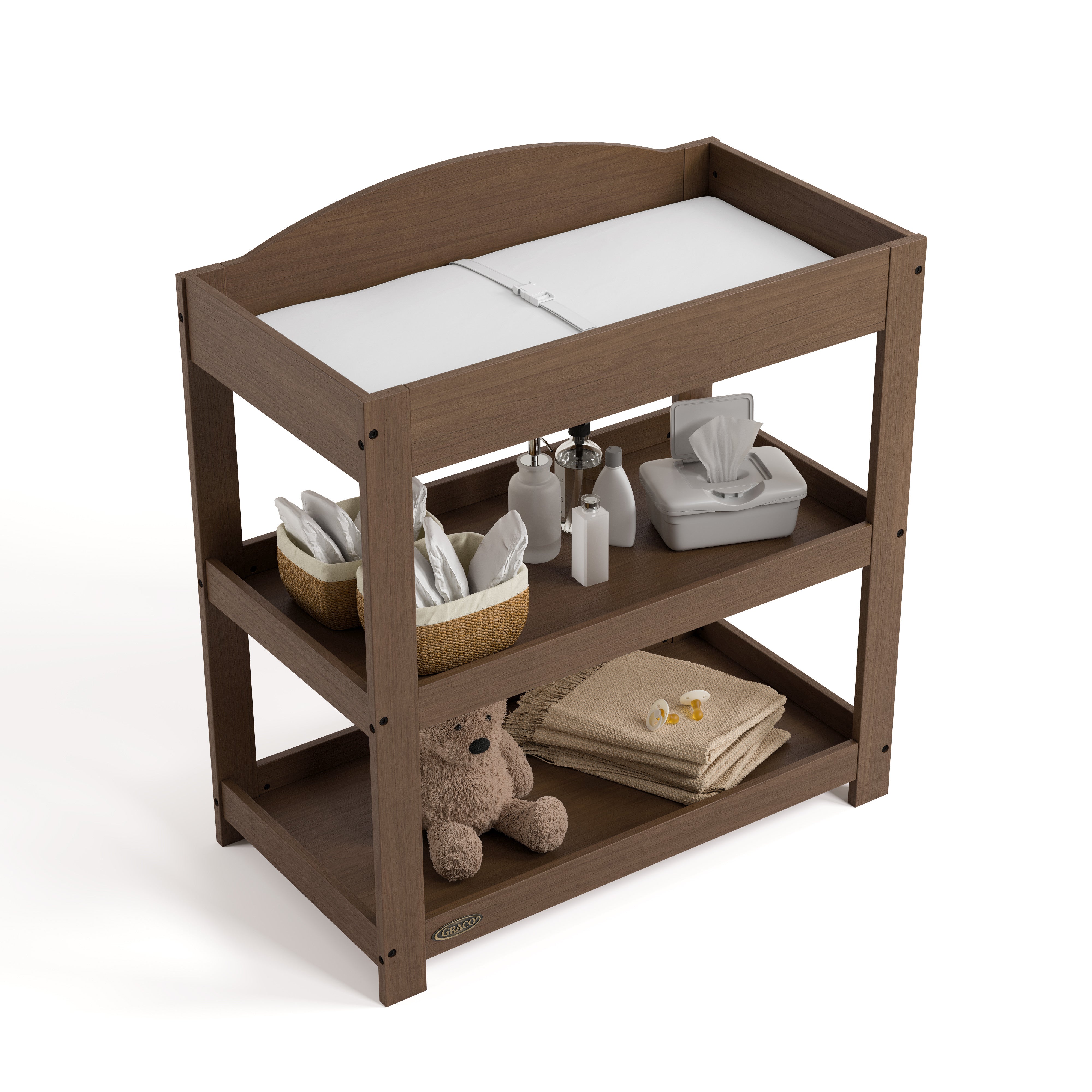 Customizable hazelnut changing table with baby items on both shelves top view