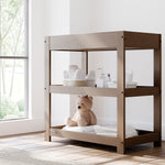 Graco hazelnut customizable changing table in nursery