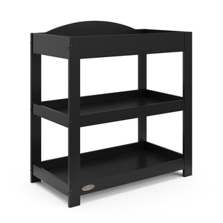Black angled changing table with removable headboard and two open shelves