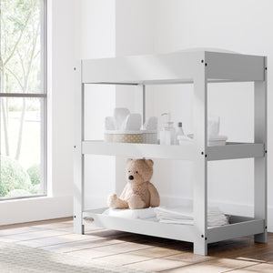 Pebble Gray changing table with removable headboard in nursery
