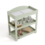 Customizable sage changing table with baby items on both shelves top view