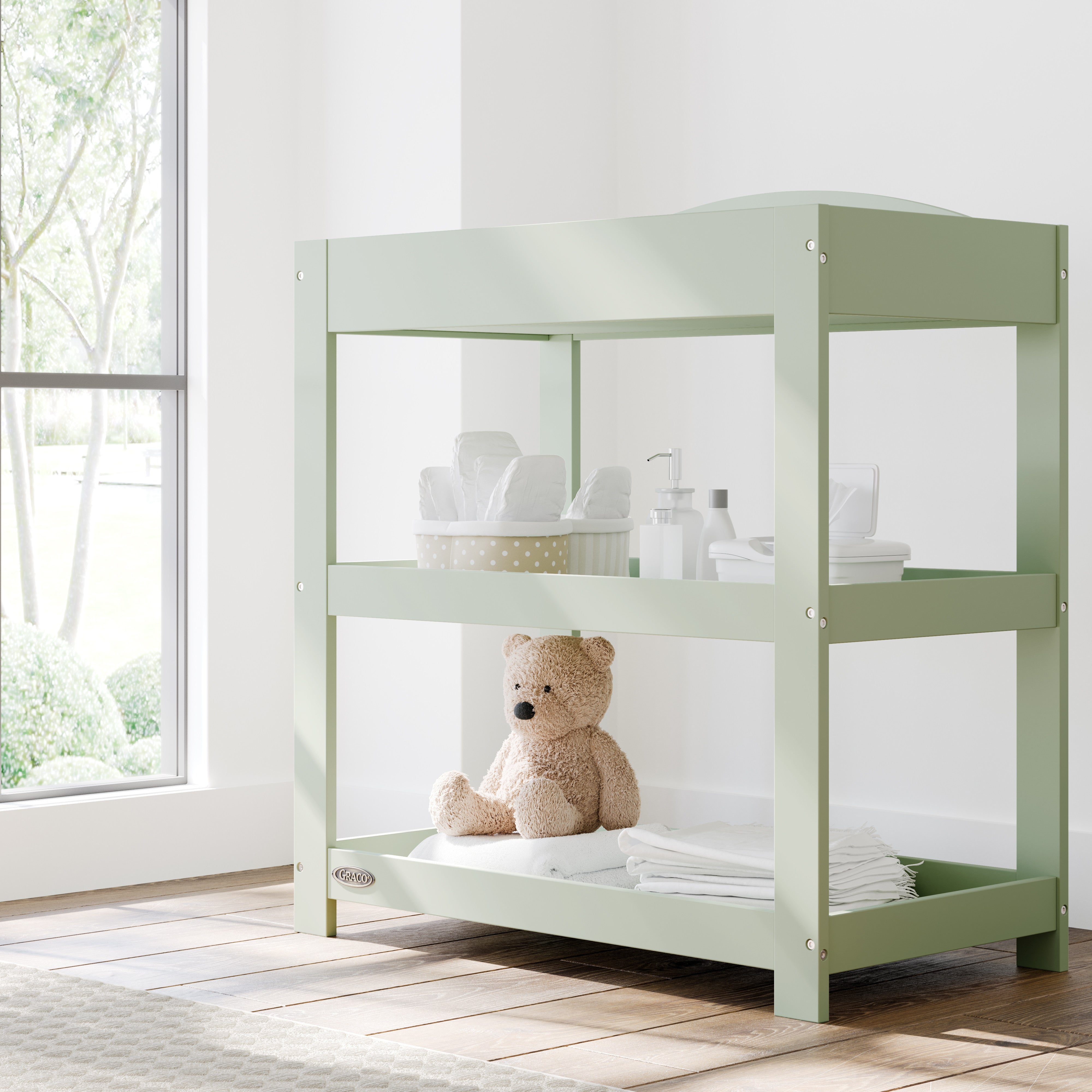 Customizable sage changing table in nursery