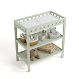 Morningside sage changing table top view with baby items on both shelves