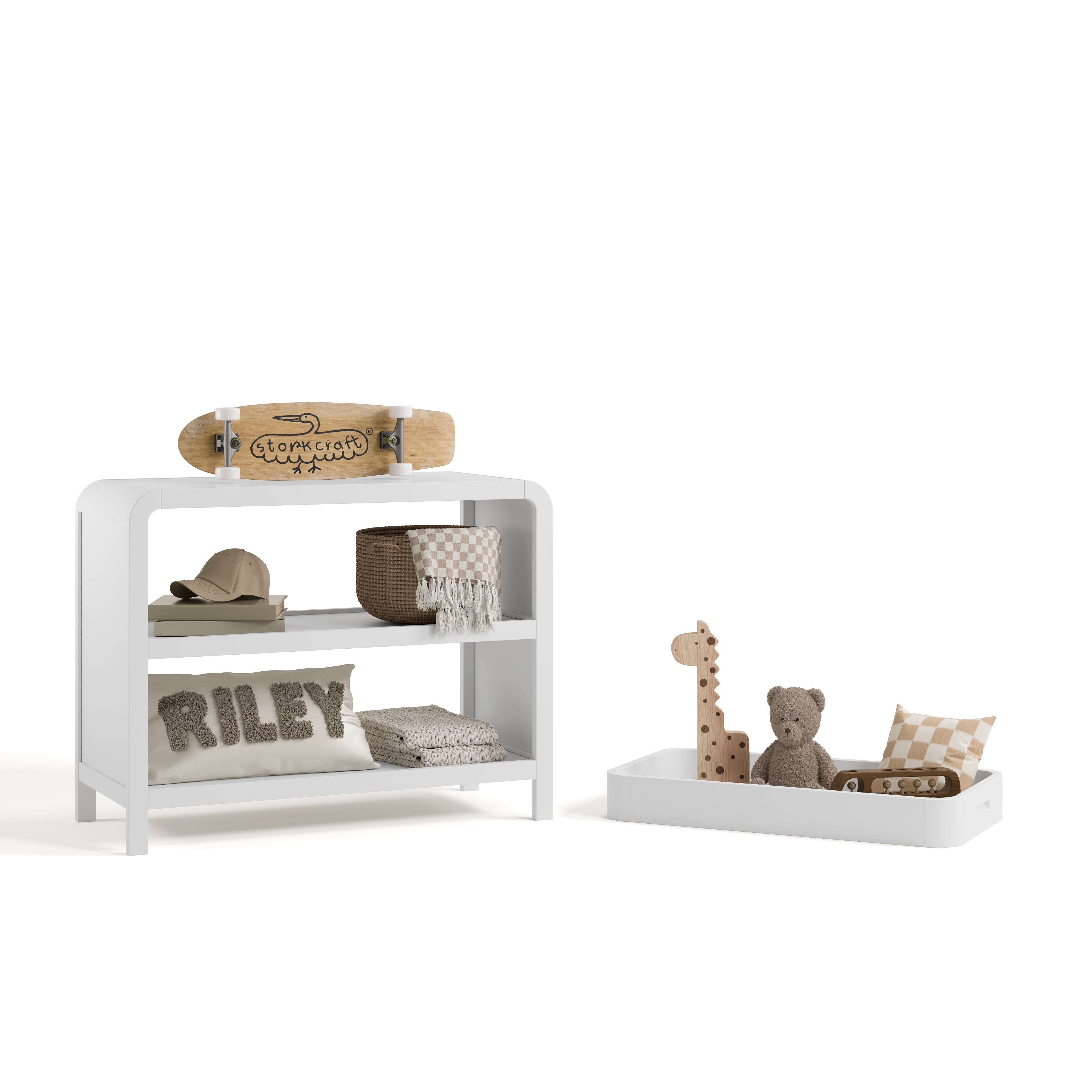 Santos white changing table with changing topper removed to the right and kids essentials on top