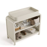 Santos frosted oat changing table with baby items on both shelves top view