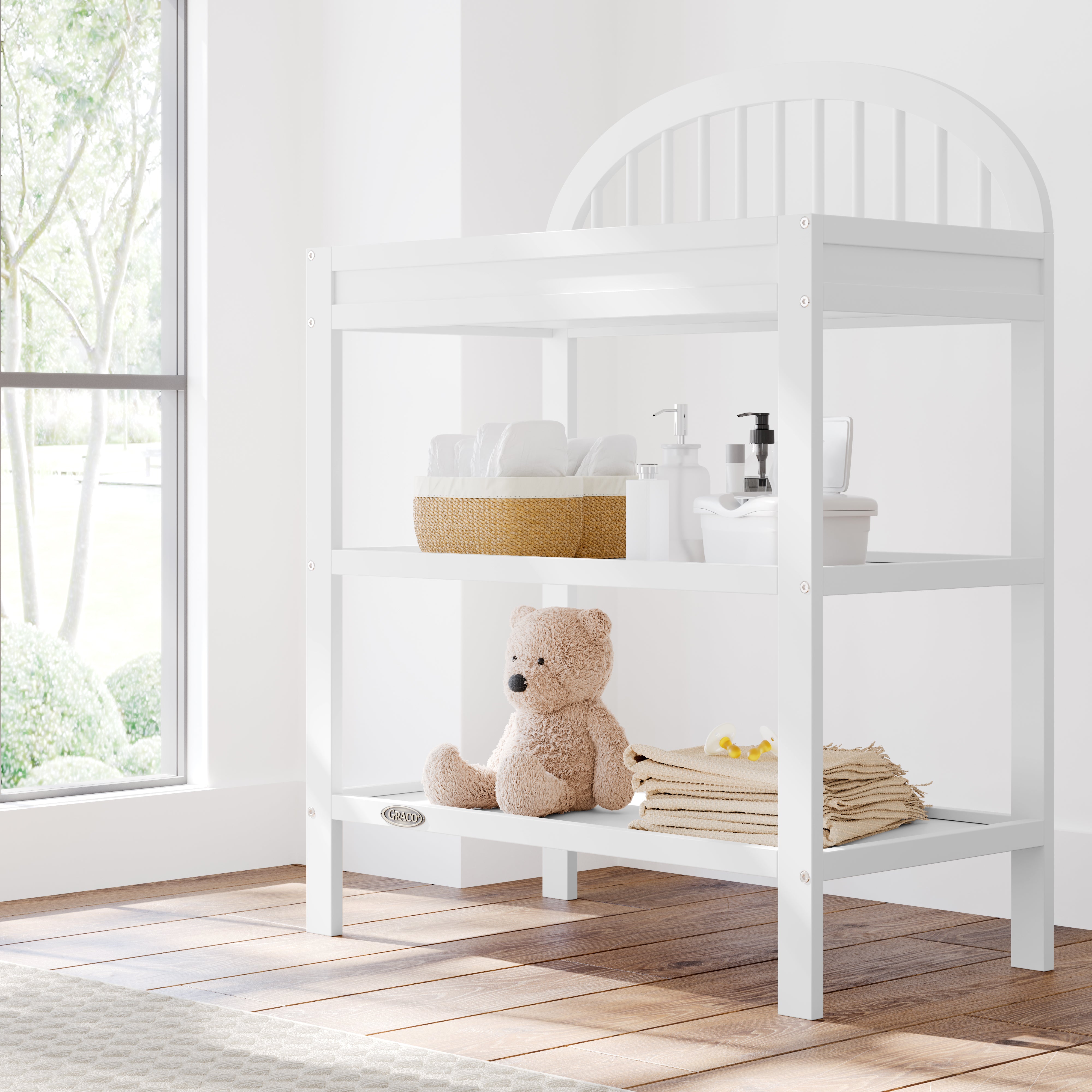 Olivia white changing table in a nursery