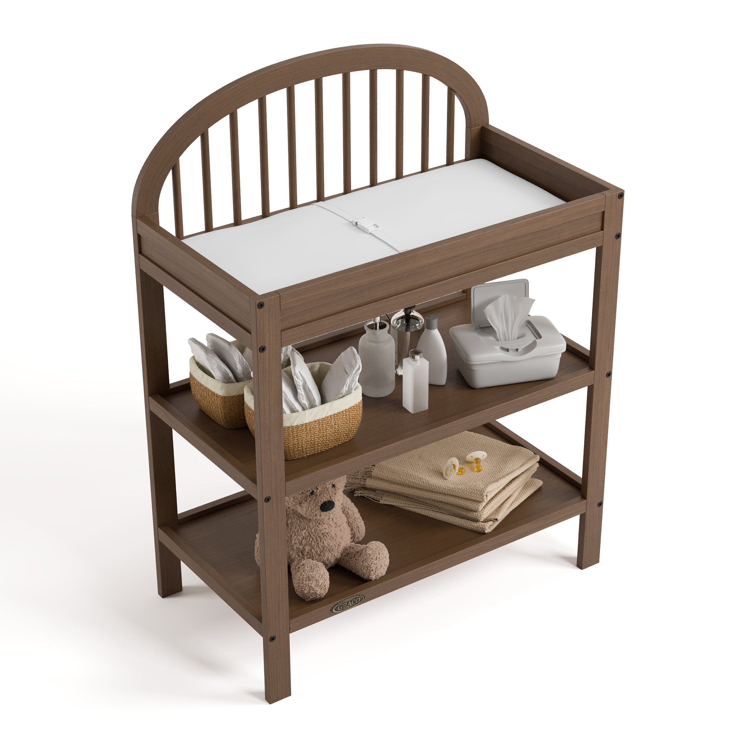 Olivia hazelnut changing table top view with baby items on both shelves