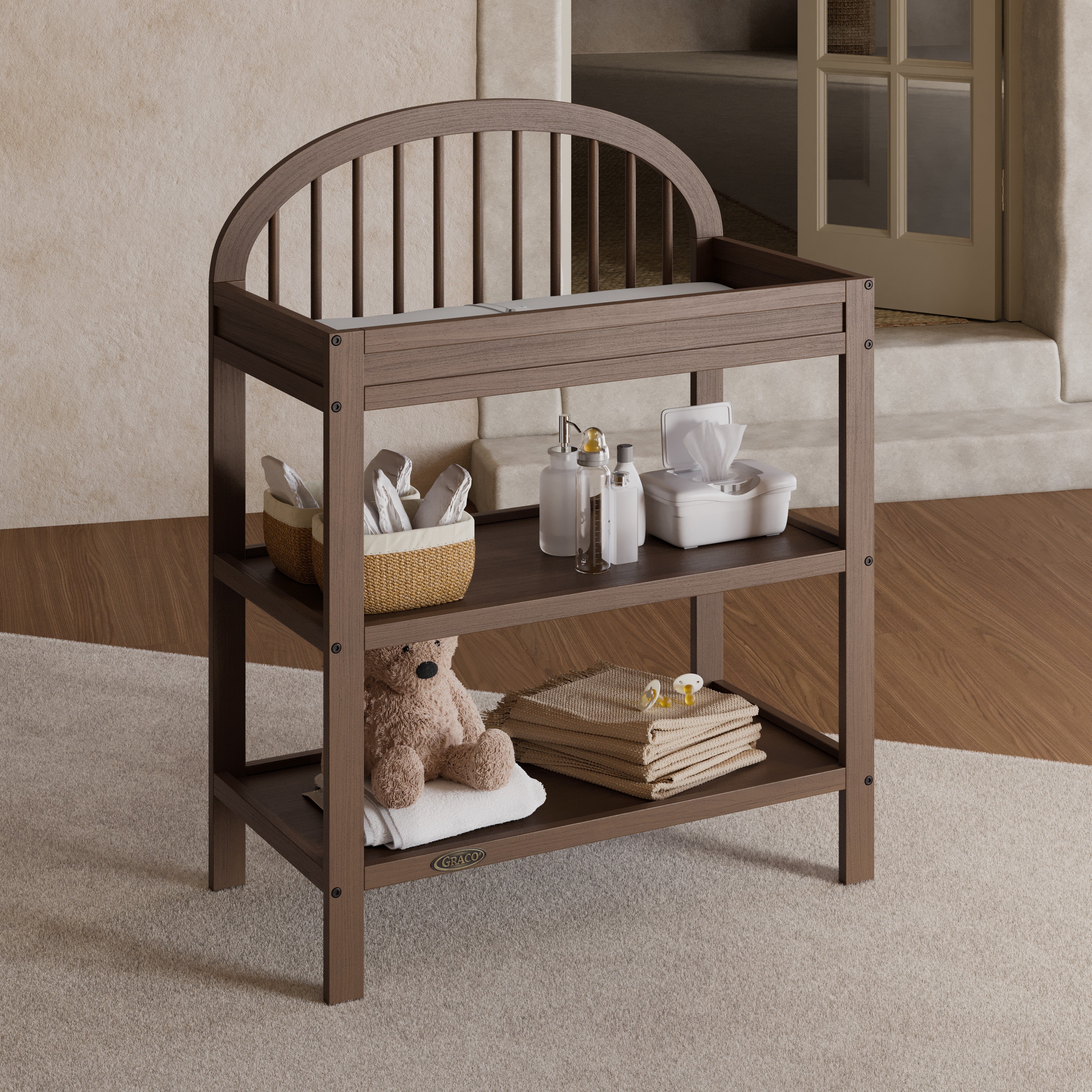 Olivia hazelnut changing table in a nursery