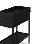 Black Graco storage changing table close up of changing topper and drawer