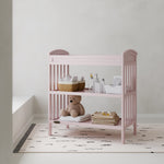Benton blush changing table in a nursery