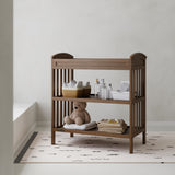 Benton hazelnut changing table in a nursery