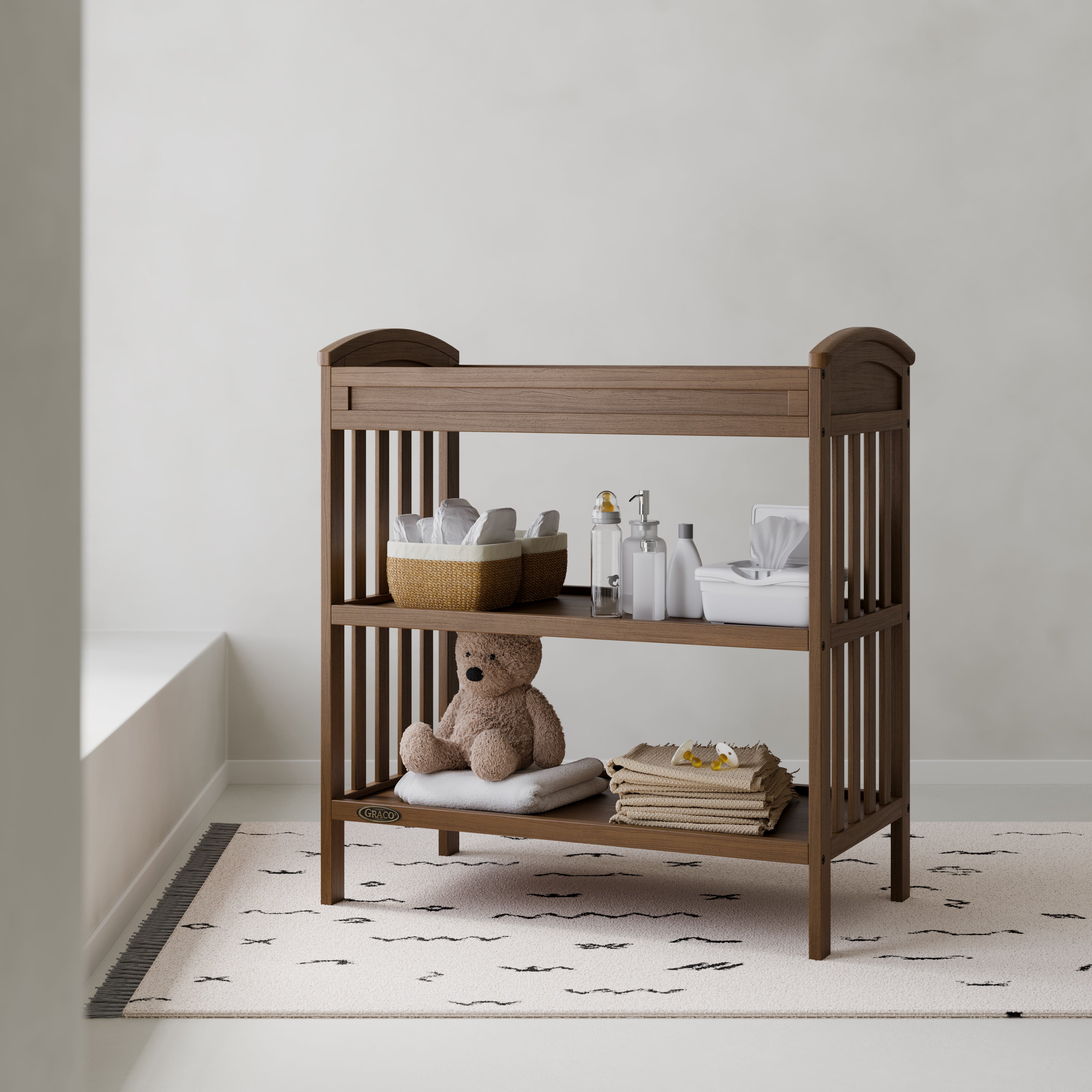 Benton hazelnut changing table in a nursery