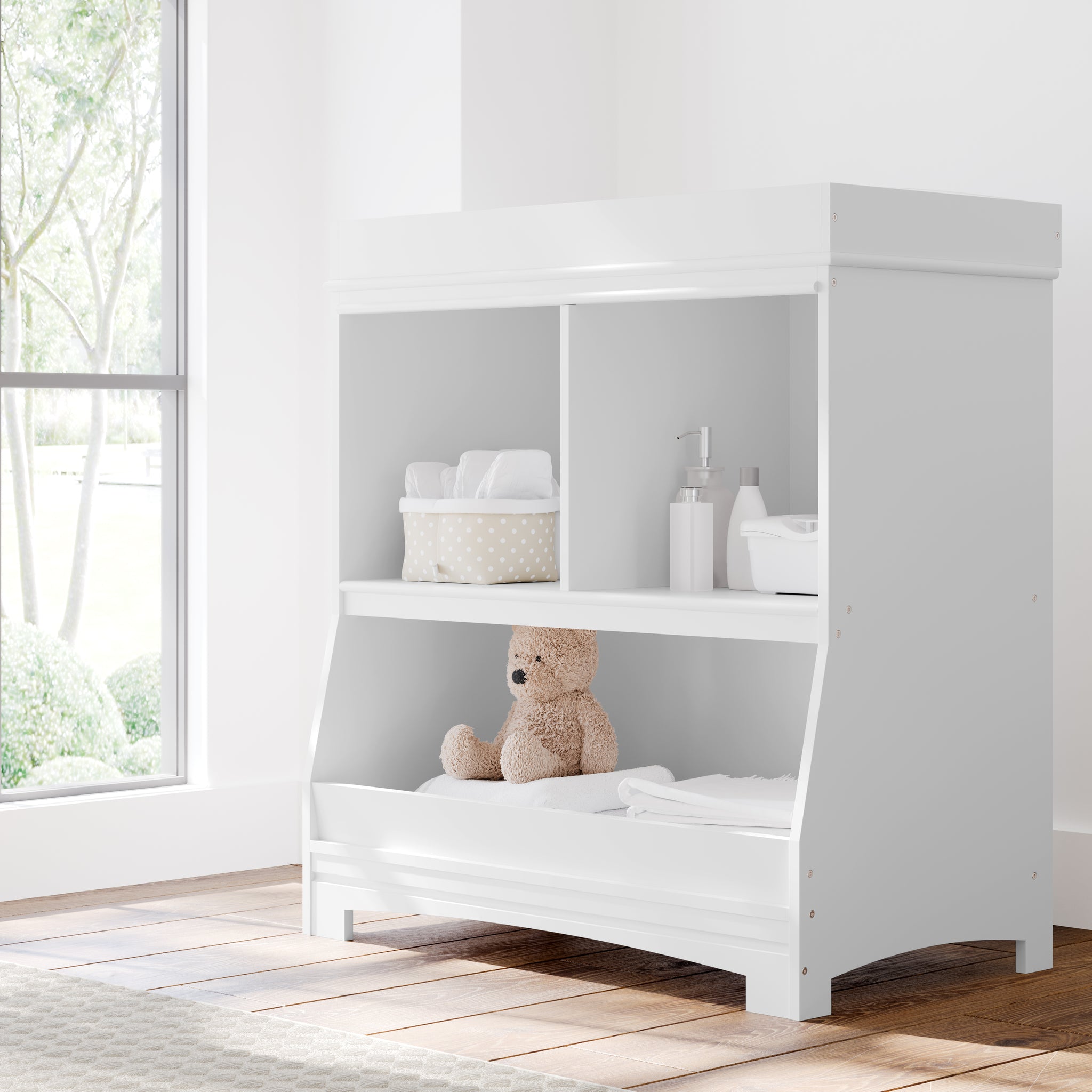 White changing table with storage in nursery
