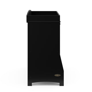 Side view of black changing table with storage