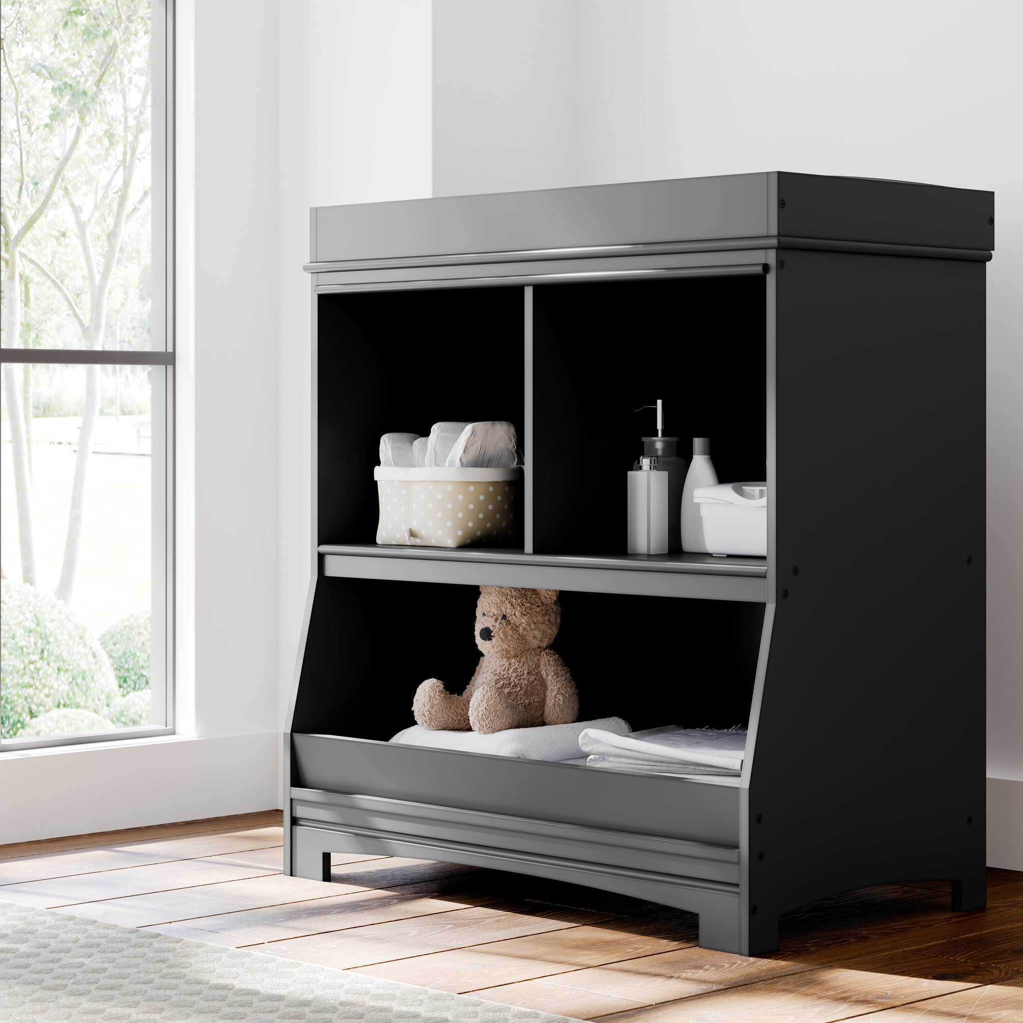Black changing table with storage in nursery