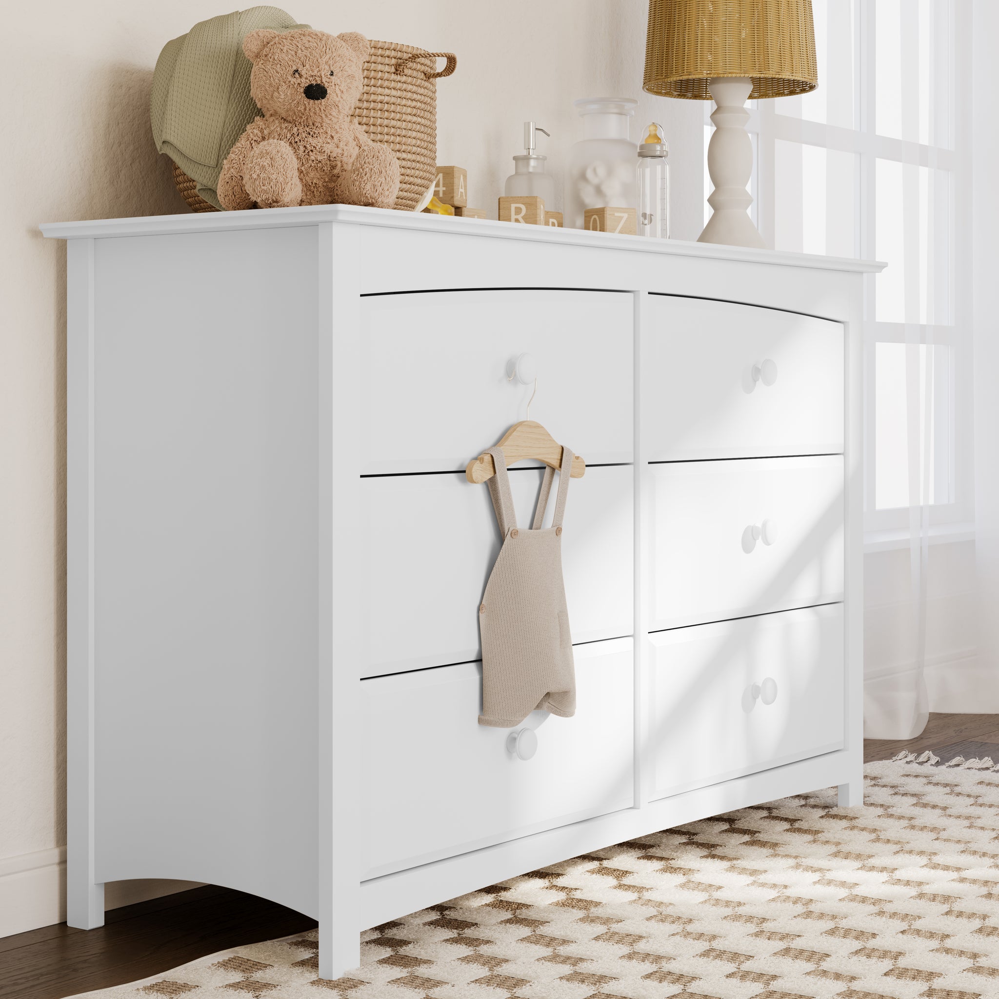angled white 6 drawer dresser in nursery 