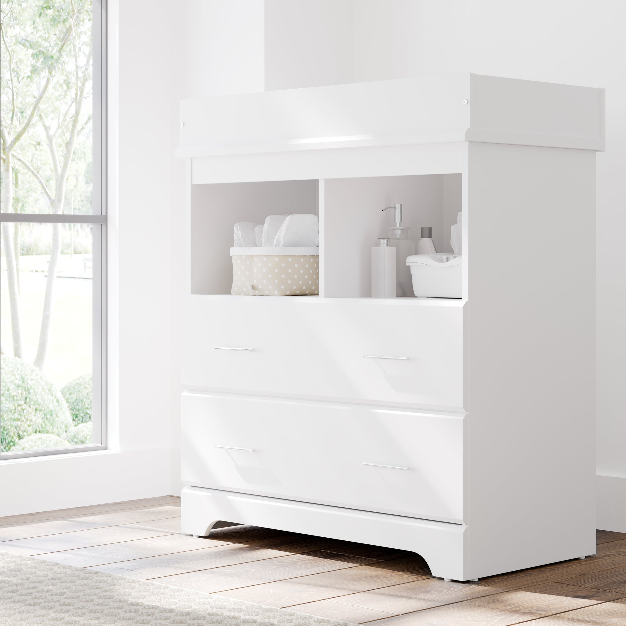 white 2 drawer chest with changing topper in nursery