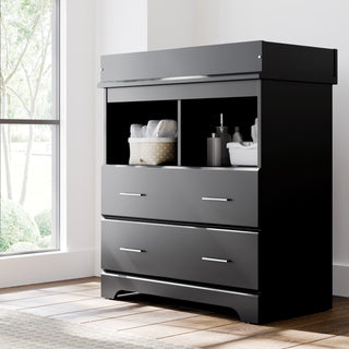 Black 2 drawer chest with changing topper in nursery