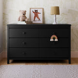 Alpine black 6 drawer dresser in a nursery