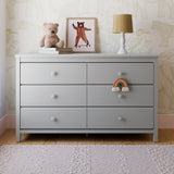 Alpine pebble gray 6 drawer dresser in a nursery