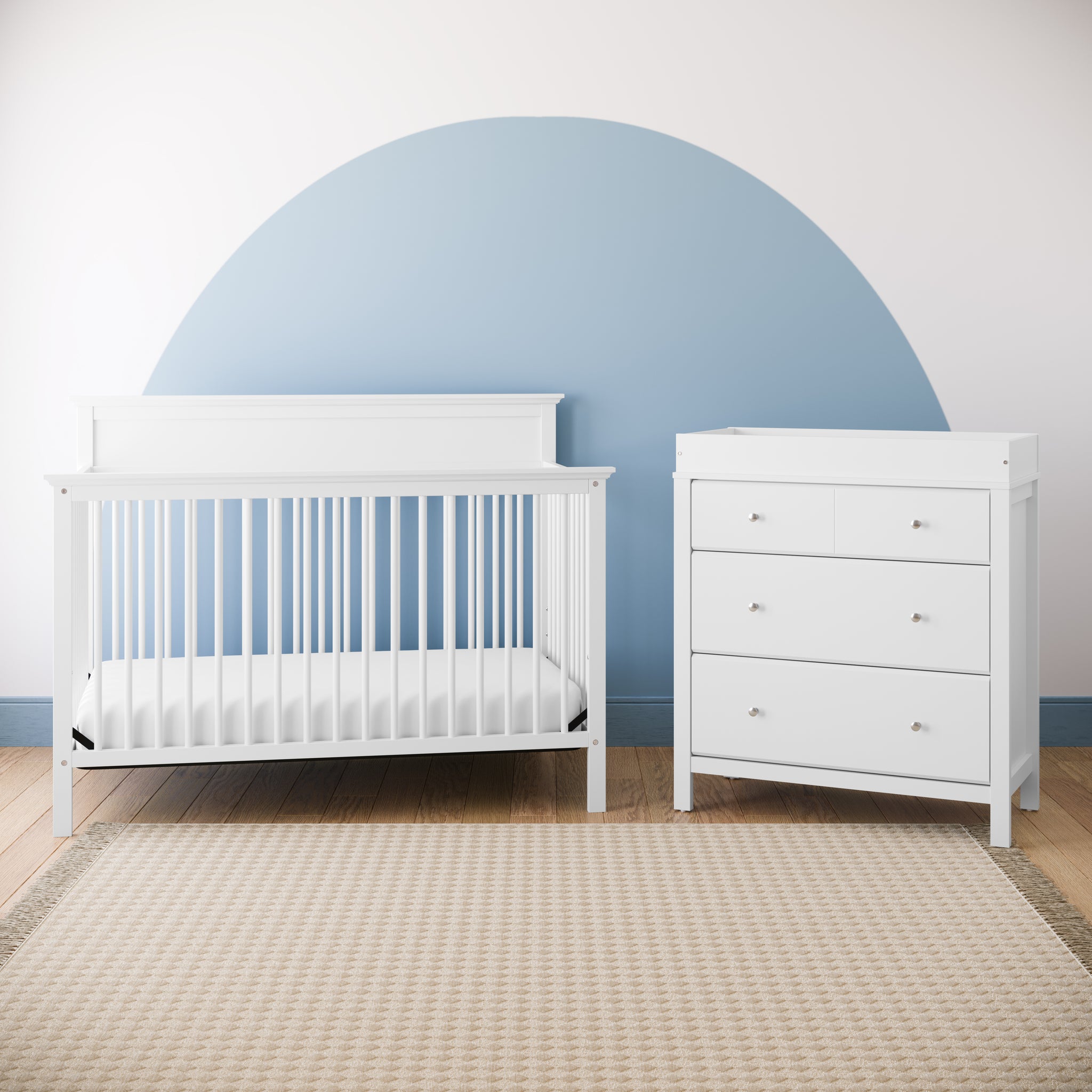 white 3 drawer chest with changing topper with crib in nursery