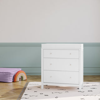 white  3 drawer chest with changing topper in nursery