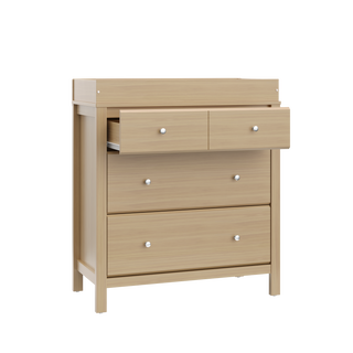 angled view of driftwood 3 drawer chest with changing topper and one open drawer
