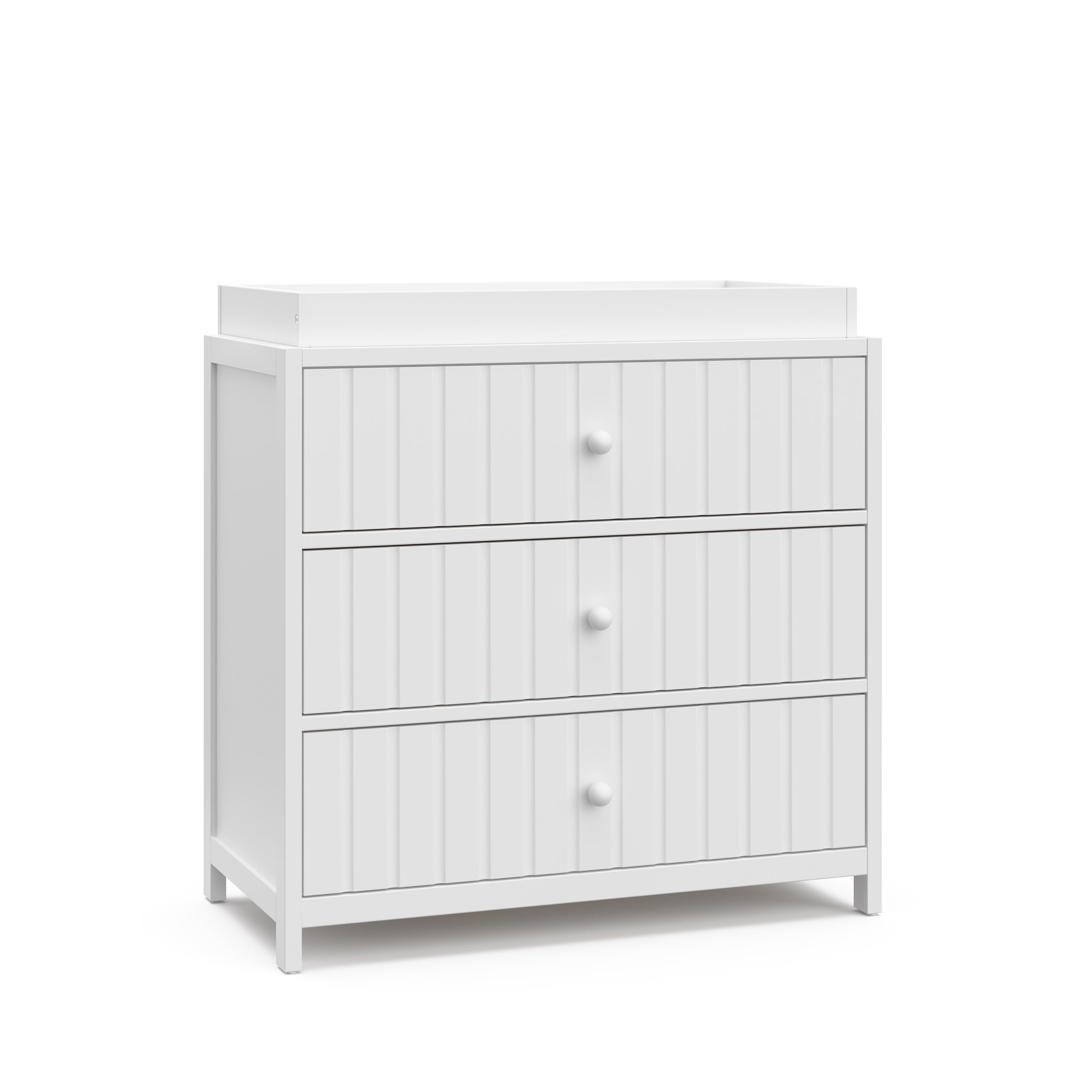 Teddi white with white knobs 3 drawer chest with changing topper angle view