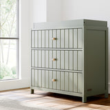 Teddi olive with driftwood knobs 3 drawer chest with changing topper in a nursery