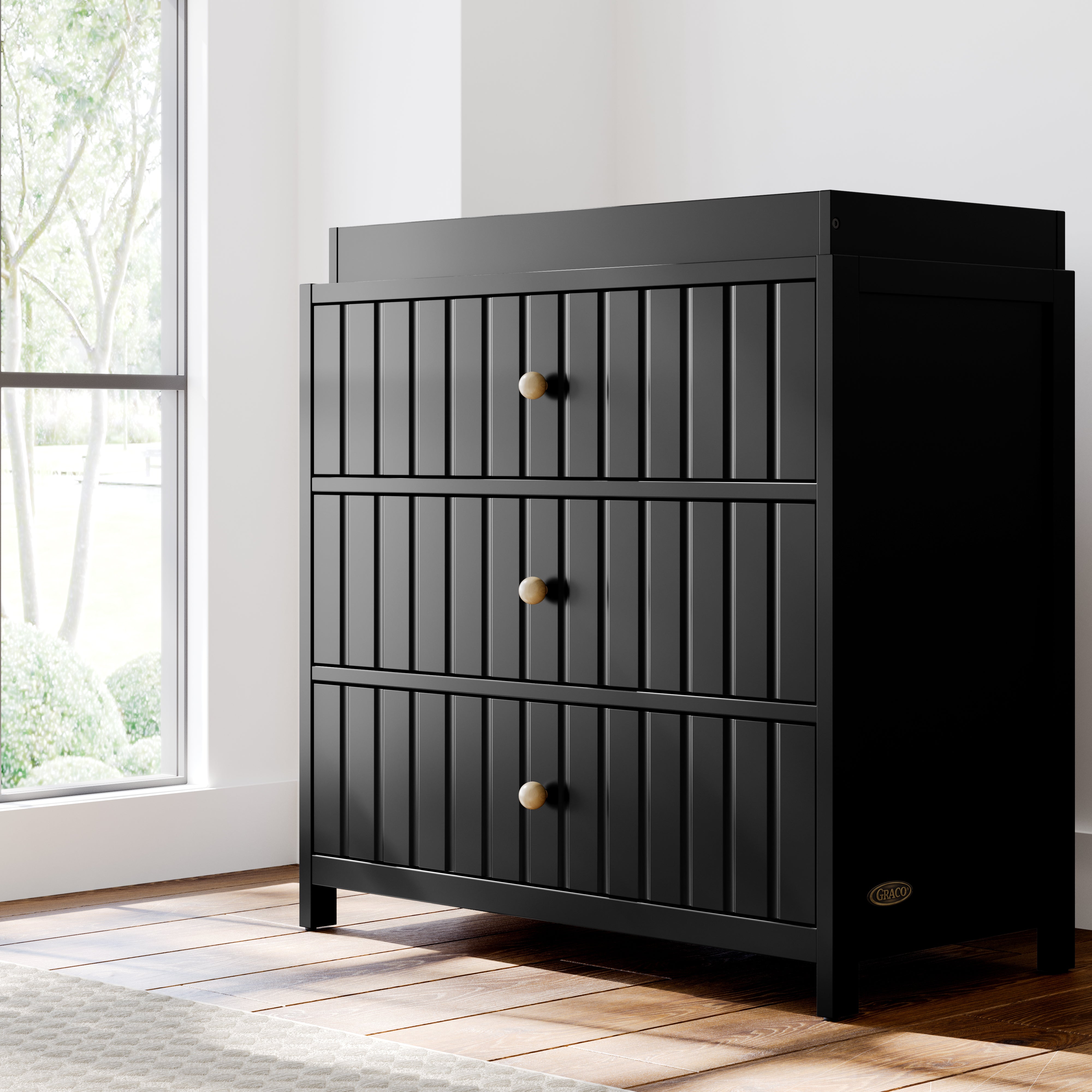 Teddi black with driftwood knobs 3 drawer chest with changing topper in a nursery