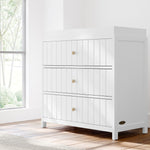 Teddi white with driftwood knobs 3 drawer chest with changing topper in a nursery