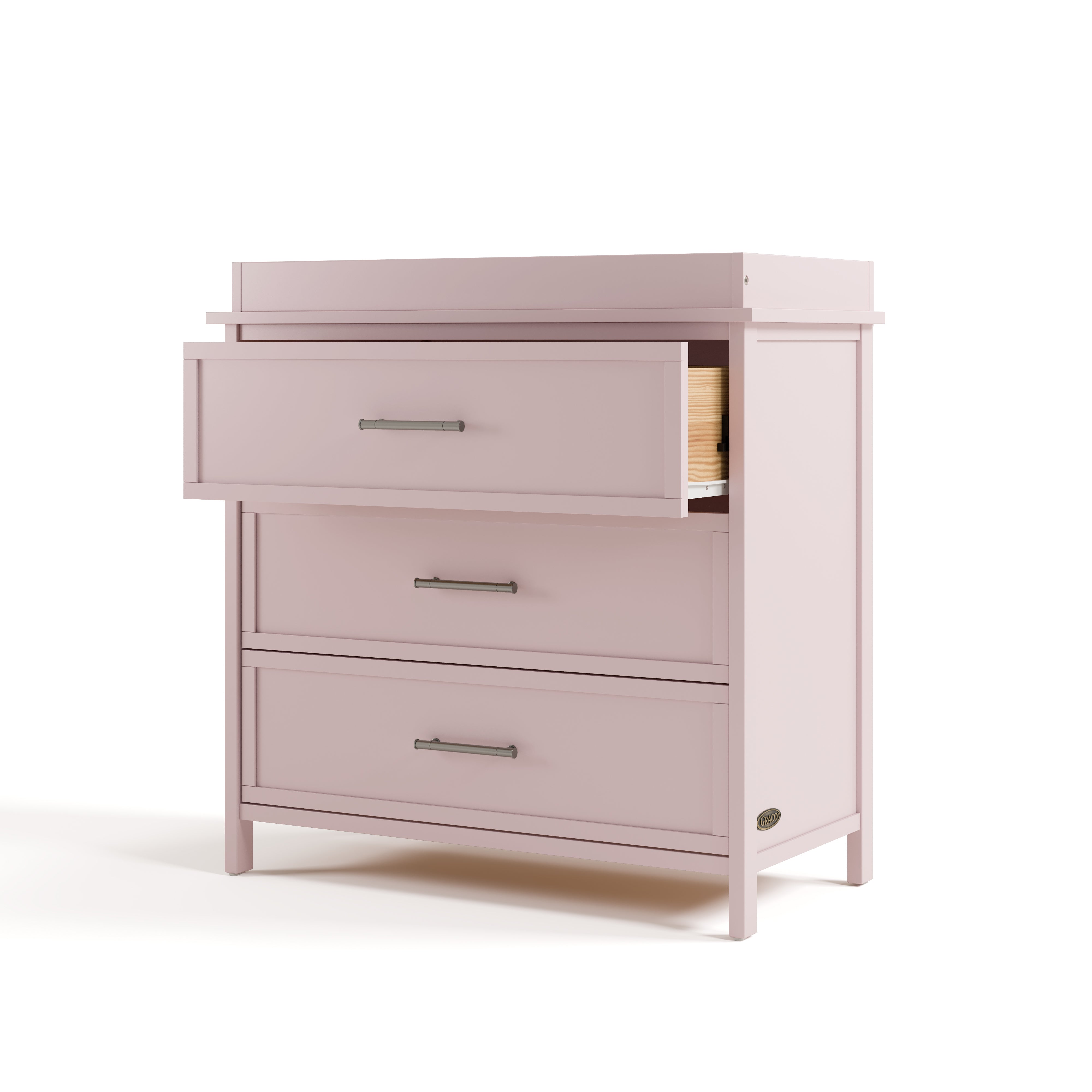 classic blush 3 drawer chest with changing topper angle view with top drawer open